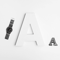 Minimalist watch and letter graphics